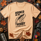 Hooked On My Hobby sarcastic graphic t-shirt in Peach by Snarky Sarks