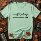 Music Keeps Me ALIVE music notes design graphic t-shirt in Mint by Snarky Sarks