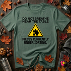 Pieces Currently Under Sorting sarcastic puzzle graphic t-shirt in Heather Forest by Snarky Sarks