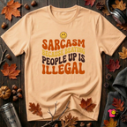 Sarcasm: Because Beating People Up Is Illegal retro smiley t-shirt in Peach by Snarky Sarks