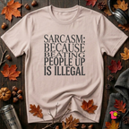 Sarcasm (Because Beating People Up Is Illegal) graphic t-shirt in Soft Pink by Snarky Sarks