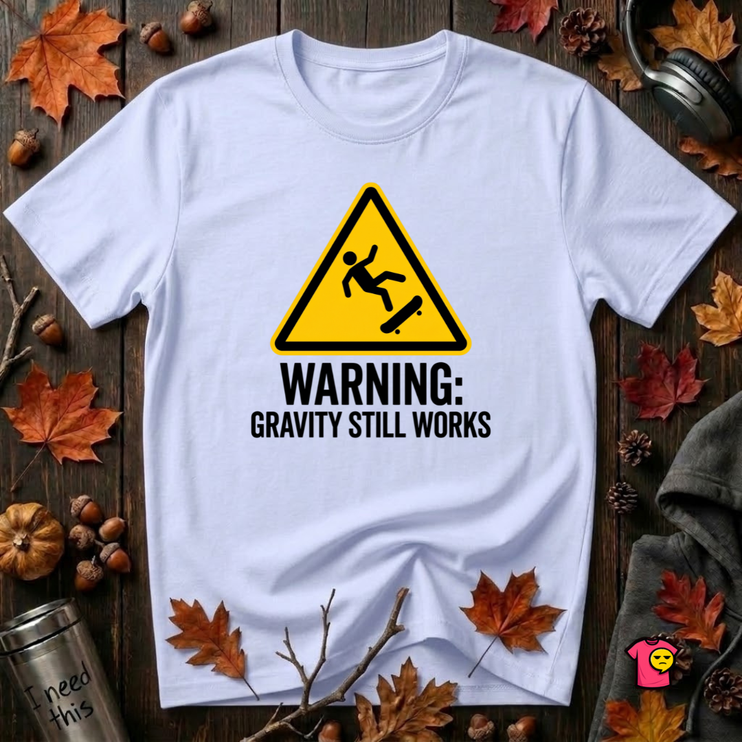Warning Gravity Still Works sarcastic graphic t-shirt in Ash by Snarky Sarks