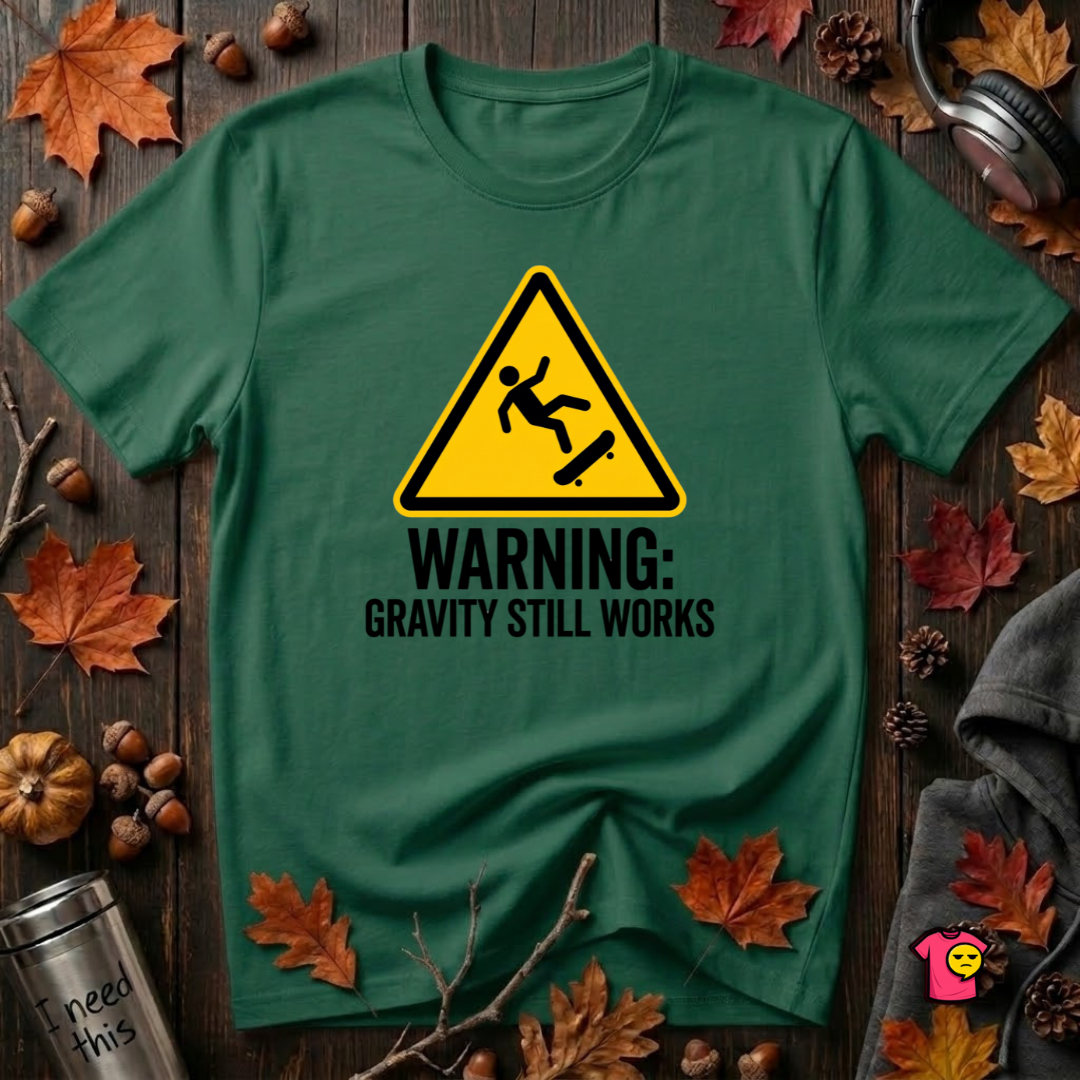 Warning Gravity Still Works sarcastic graphic t-shirt in Evergreen by Snarky Sarks