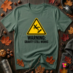 Warning Gravity Still Works sarcastic graphic t-shirt in Heather Forest by Snarky Sarks