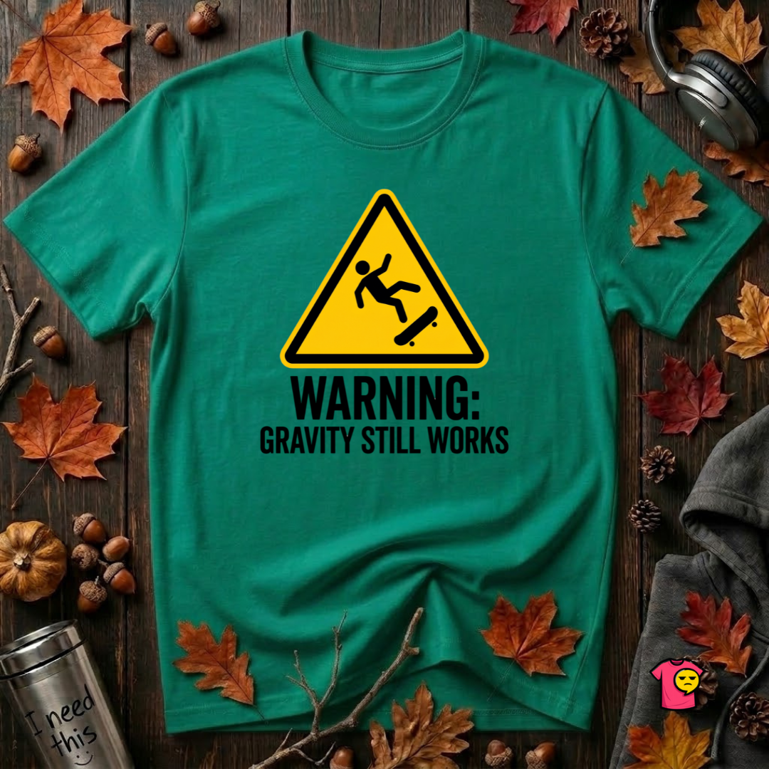 Warning Gravity Still Works sarcastic graphic t-shirt in Heather Kelly by Snarky Sarks