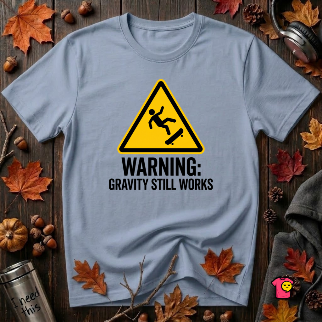 Warning Gravity Still Works sarcastic graphic t-shirt in Heather Prism Blue by Snarky Sarks