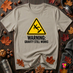 Warning Gravity Still Works sarcastic graphic t-shirt in Heather Stone by Snarky Sarks
