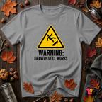 Warning Gravity Still Works sarcastic graphic t-shirt in Heather Storm by Snarky Sarks