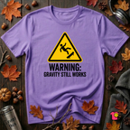 Warning Gravity Still Works sarcastic graphic t-shirt in Heather Team Purple by Snarky Sarks