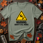 Warning Gravity Still Works sarcastic graphic t-shirt in Military Green by Snarky Sarks