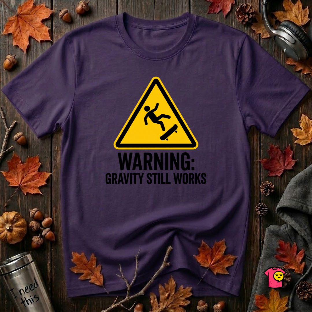 Warning Gravity Still Works sarcastic graphic t-shirt in Purple by Snarky Sarks