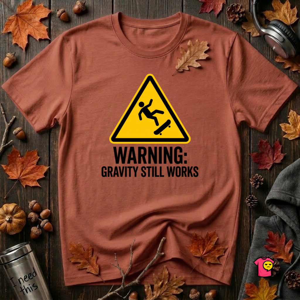 Warning Gravity Still Works sarcastic graphic t-shirt in Rust by Snarky Sarks