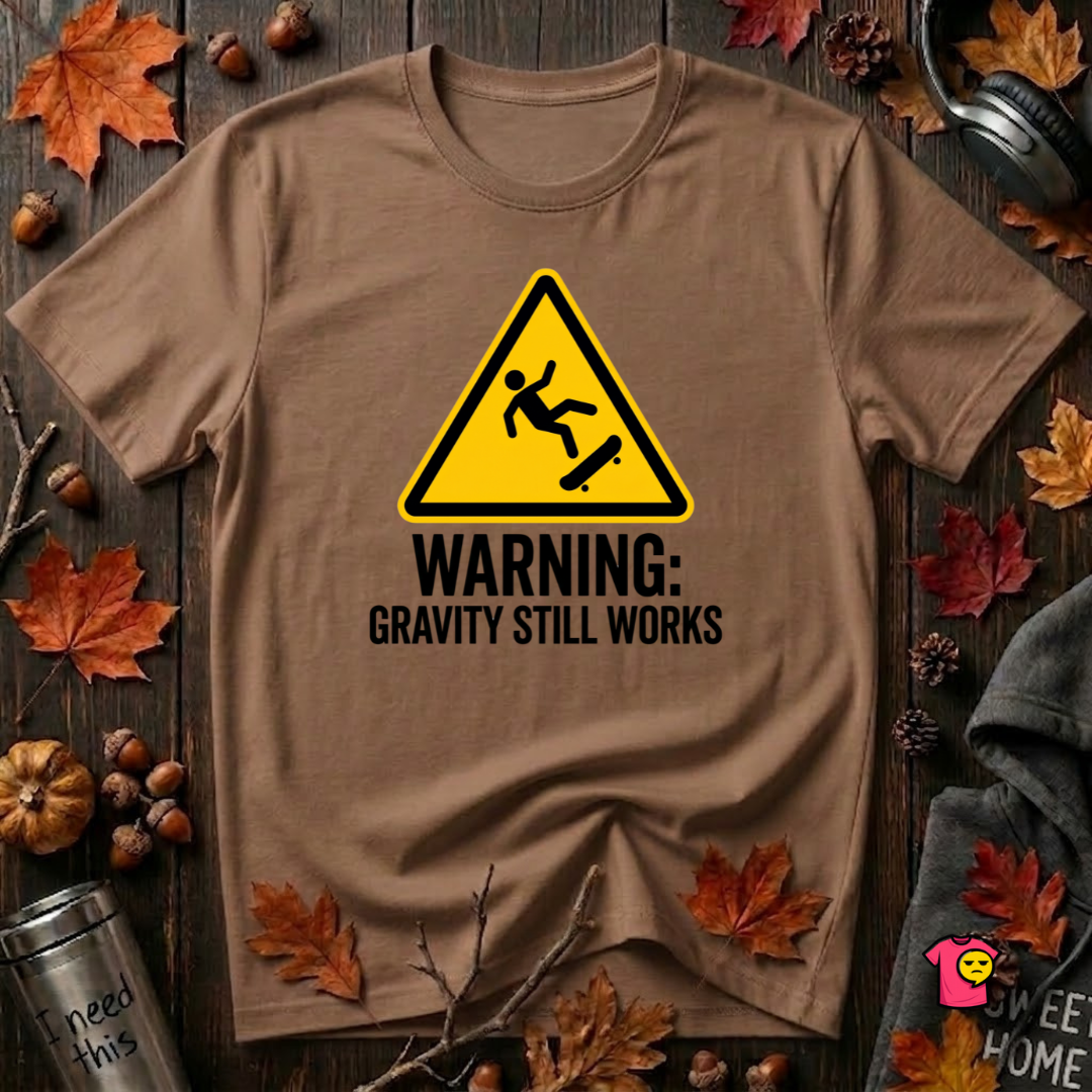 Warning Gravity Still Works sarcastic graphic t-shirt in Sand Dune by Snarky Sarks