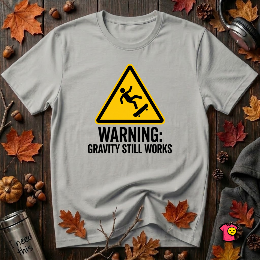 Warning Gravity Still Works sarcastic graphic t-shirt in Silver by Snarky Sarks