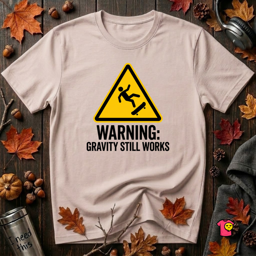 Warning Gravity Still Works sarcastic graphic t-shirt in Soft Pink by Snarky Sarks